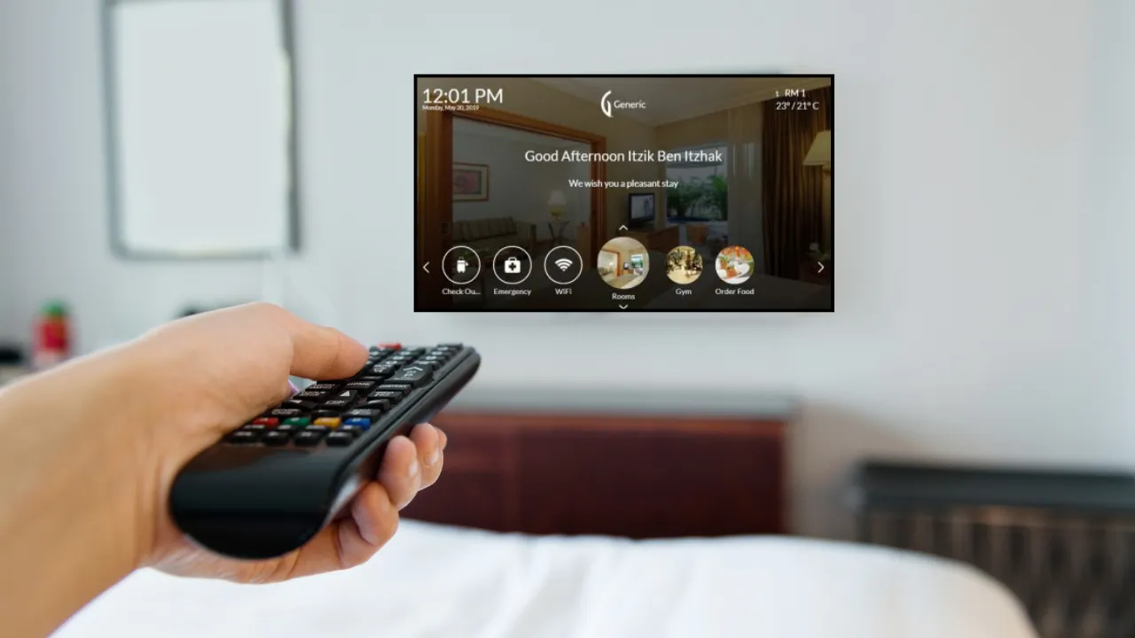 Guest using a remote control with the CEF hotel TV platform welcome screen on an in-room television