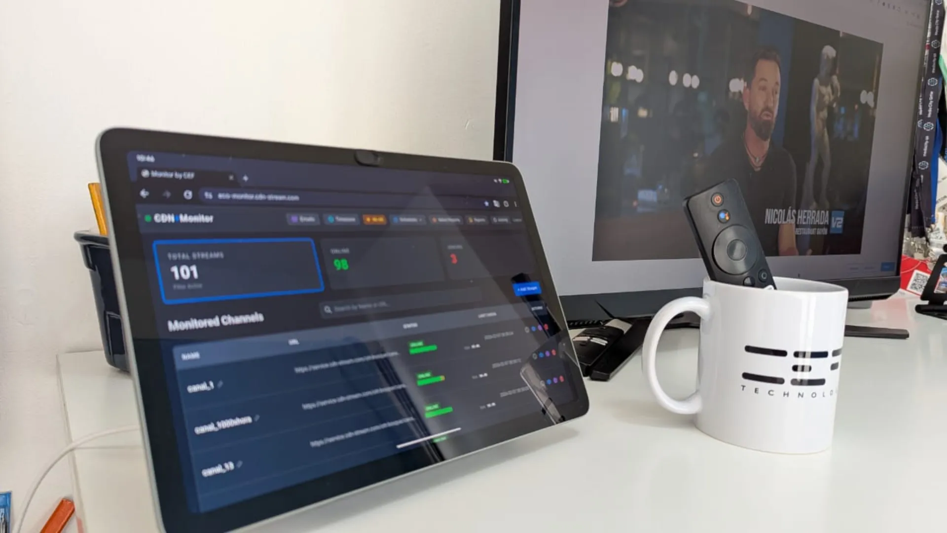 Stream Monitor dashboard on a tablet showing channel quality alerts next to a live television feed